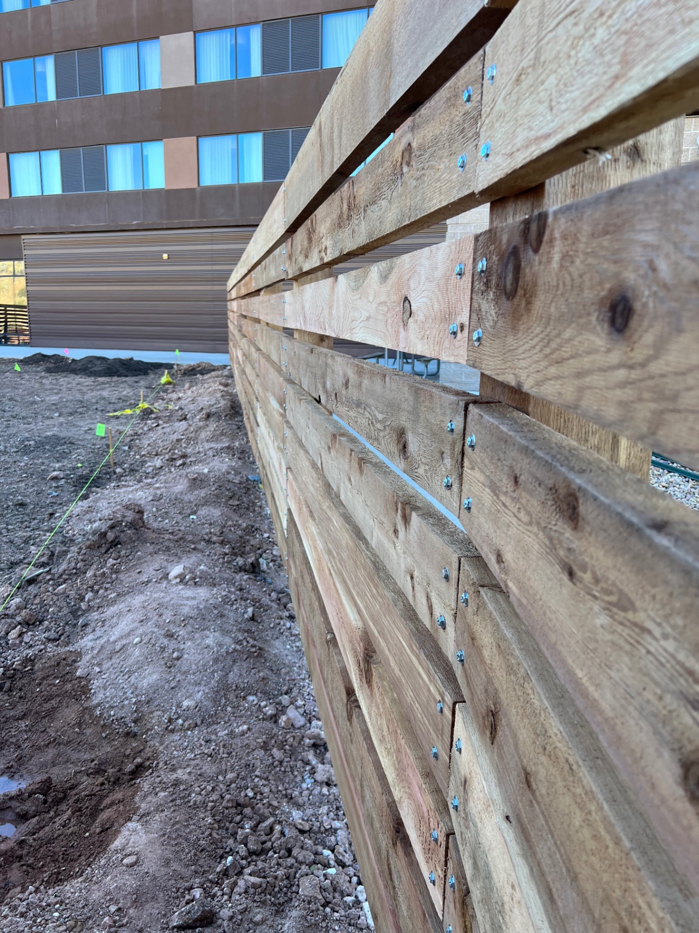 Close up of a custom horizontal wood privacy fence installation